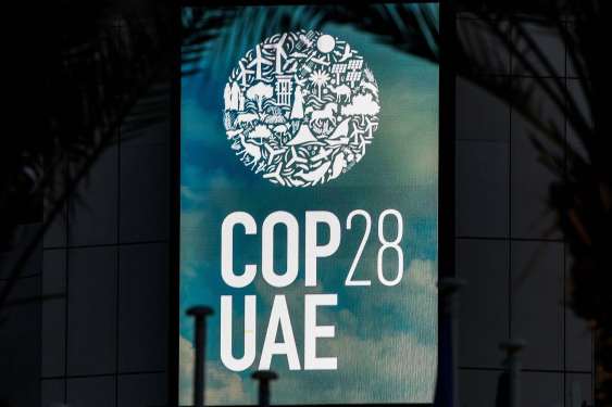 The logo of the United Nations Climate Change Conference COP28 is pictured at Expo City in Dubai on December 12, 2023.