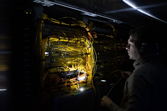 A worker adjusts server cables at a data center inside the VK Company Ltd. office in Moscow, Russia, on Wednesday, Jan. 19, 2022.