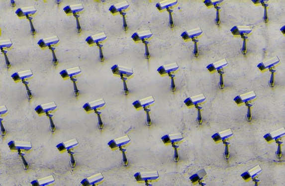 a pattern of CCTV surveillance cameras on a wall, moshed with a blue and yellow jitter effect, all pointing in different directions.