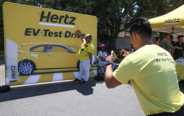 Guests attend as Hertz kicks off one of the country’s largest electric vehicle test drives at the company’s Los Angeles International Airport location on July 19, 2023