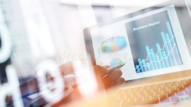 Businessman analyzing sales data and pointing at business graph chart growth and progress on laptop screen. Digital marketing. stock photos