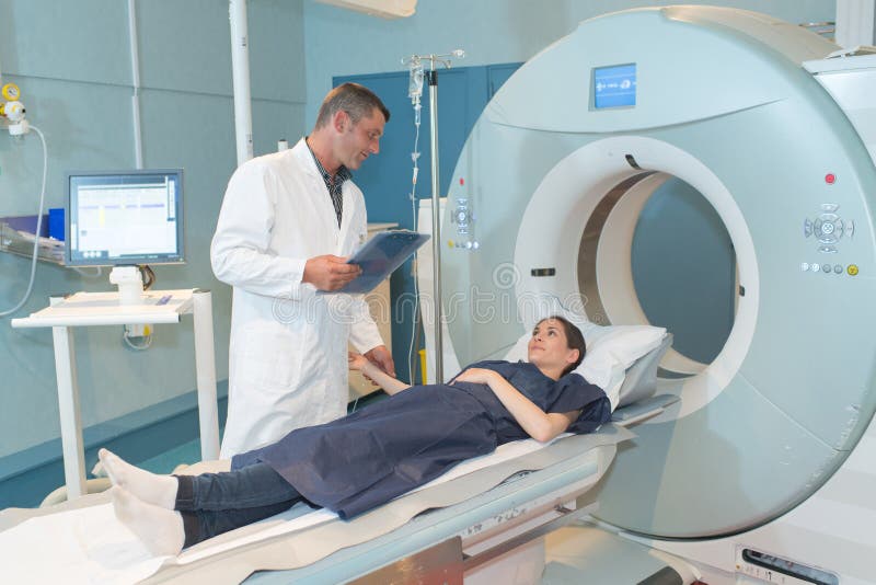 Female patient talking to doctor before mri scan mri