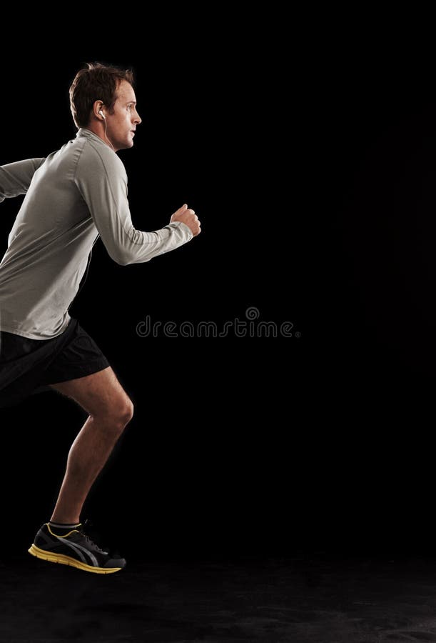 Man, cardio and running exercise in studio for athlete performance or marathon, training or black background. Male stock photo