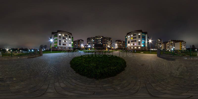 Night 360 hdri panorama near playground in middle of modern multi-storey multi-apartment residential complex of urban development stock image