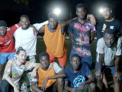 Asylum seekers from Mauritania pose for a photo after a Wednesday night scrimmage in September 2023 at Grover Cleveland Park in Ridgewood Queens.