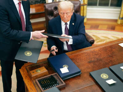 President Donald Trump signs a series of executive orders at the White House on January 20, 2025, in Washington, D.C.