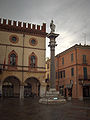 Palazzetto Veneziano with column and statue Saint Vitalis