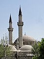 The minarets of the mosque seen from outside the fence