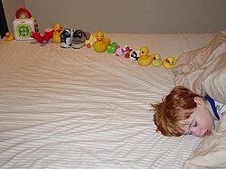 Autistic-sweetiepie-boy-with-ducksinarow.jpg