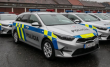 A silver-coloured Slovak police car with a blue-yellow pattern