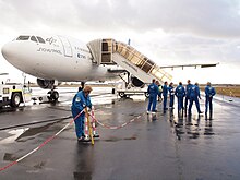 A group boarding a plane