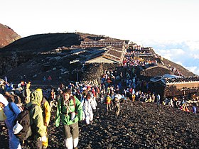 Hikers crowded at the summit of Mount Fuji