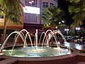 The fountain at one end of Era Walk at night