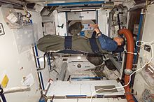 Astronaut sleeping inside a bag