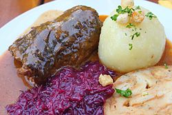 Beef roulade with red cabbage and bread pudding and potato dumplings