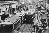 Tram on a busy city street