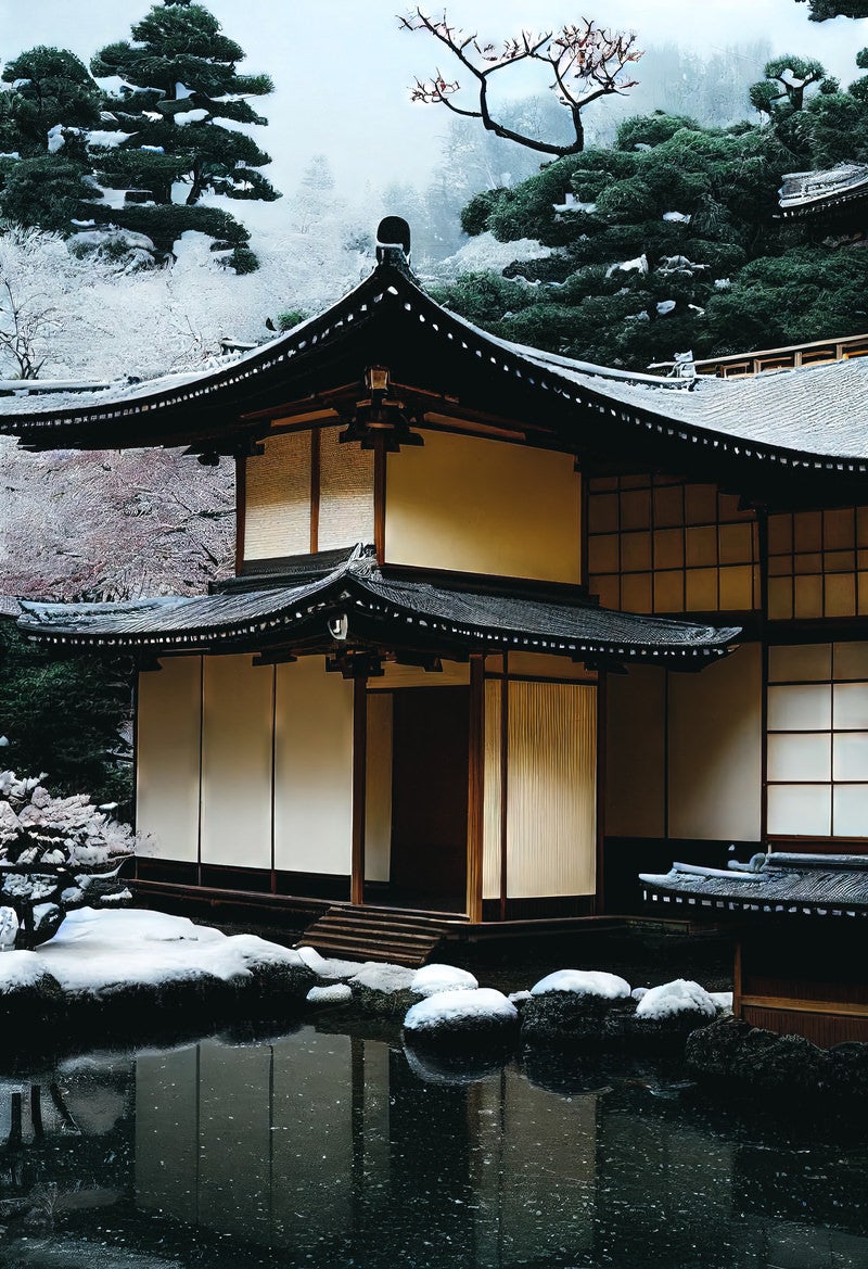 「屋根に積もる初雪と池泉」の写真