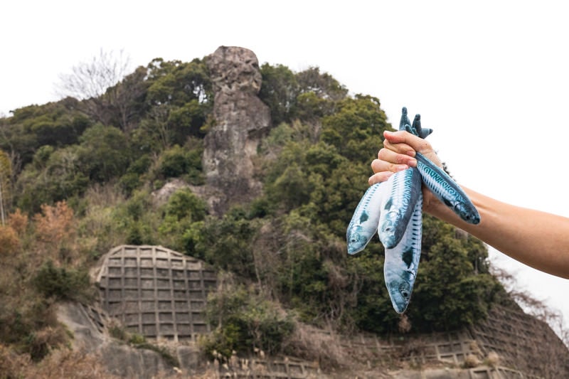 魚売りと鯖くさらかし岩の写真