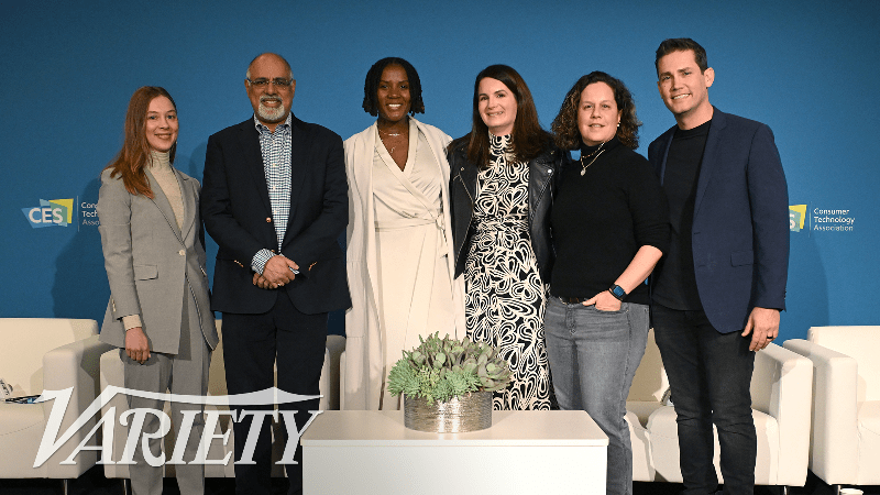 Variety Intelligence Platform's Audrey Schomer posing for a photo with execs from Roblox, National Geographic, the NFL, PepsiCo and Mastercard at CES 2024.