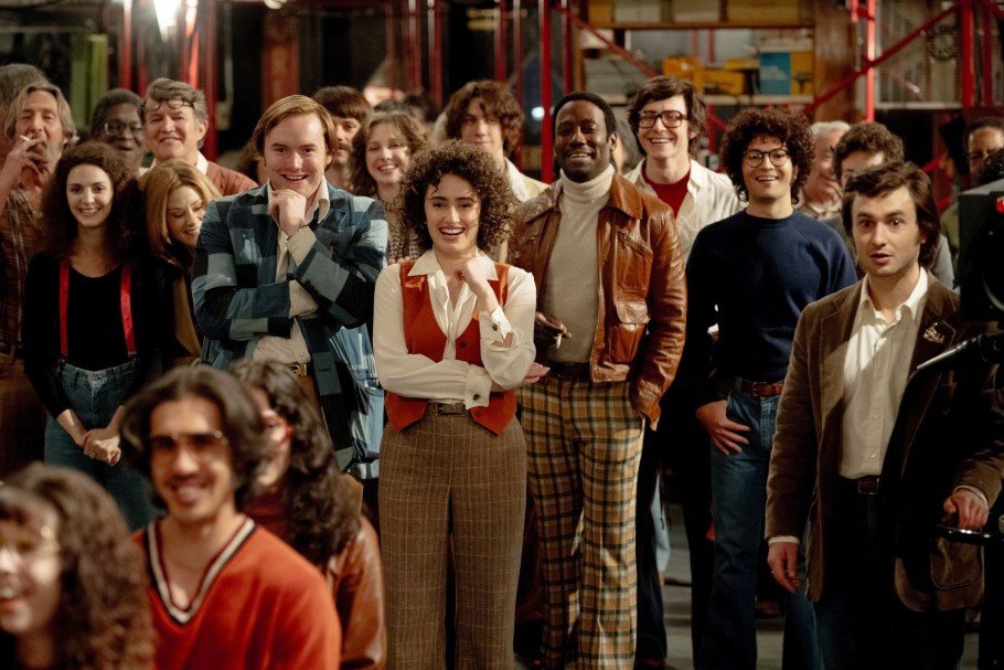 SATURDAY NIGHT, from left: Ella Hunt as Gilda Radner (suspenders), Kim Matula as Jane Curtain, Cooper Hoffman as Dick Ebersol (blue jacket), Rachel Sennott as Rosie Shuster (center), Lamorne Morris as Garrett Morris (brown jacket), Josh Brener as Alan Zweibel, Gabriel LaBelle as Lorne Michaels, 2024.  ph: Hopper Stone /© Sony Pictures Releasing / Courtesy Everett Collection