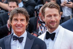 CANNES, FRANCE - MAY 18: Tom Cruise and Glen Powell attend the screening of "Top Gun: Maverick" during the 75th annual Cannes film festival at Palais des Festivals on May 18, 2022 in Cannes, France. (Photo by Marc Piasecki/FilmMagic)