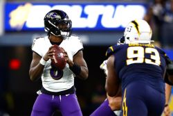 INGLEWOOD, CALIFORNIA - NOVEMBER 26: Lamar Jackson #8 of the Baltimore Ravens looks to throw a pass against the Los Angeles Chargers during the second quarter in the game at SoFi Stadium on November 26, 2023 in Inglewood, California. (Photo by Ronald Martinez/Getty Images)