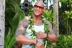 KAPOLEI, HAWAII - NOVEMBER 21: Dwayne Johnson dances as he arrives at the world premiere of 'Moana 2' at Lanikuhonua Cultural Institute on November 21, 2024 in Kapolei, Hawaii. (Photo by Darryl Oumi/Getty Images)