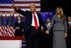 WEST PALM BEACH, FLORIDA - NOVEMBER 06:  Republican presidential nominee, former U.S. President Donald Trump points to supporters with former first lady Melania Trump during an election night event at the Palm Beach Convention Center on November 06, 2024 in West Palm Beach, Florida. Americans cast their ballots today in the presidential race between Republican nominee former President Donald Trump and Vice President Kamala Harris, as well as multiple state elections that will determine the balance of power in Congress.   (Photo by Chip Somodevilla/Getty Images)