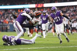 CHICAGO, ILLINOIS - NOVEMBER 24: Roschon Johnson #23 of the Chicago Bears is tackled by Shaquill Griffin #1 of the Minnesota Vikings during the fourth quarter at Soldier Field on November 24, 2024 in Chicago, Illinois. (Photo by Luke Hales/Getty Images)