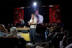 NEW YORK, NEW YORK - JANUARY 24: (Exclusive Coverage) Ryan Reynolds speaks from the crowd as Hugh Jackman performs onstage during Hugh Jackman: From New York, With Love at Radio City Music Hall on January 24, 2025 in New York City. (Photo by Kevin Mazur/Kevin Mazur/Getty Images for Hugh Jackman)