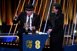 LONDON, ENGLAND - FEBRUARY 16: Jacques Audiard (L) accepts the Film Not in the English Language Award for 'Emilia Pérez' on stage during the EE BAFTA Film Awards 2025 at The Royal Festival Hall on February 16, 2025 in London, England. (Photo by Stuart Wilson/BAFTA/Getty Images for BAFTA)