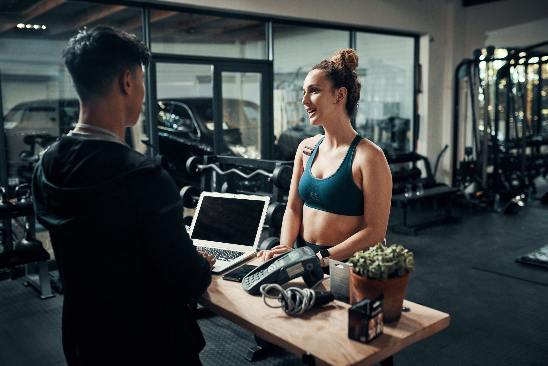 woman at the front desk at the gym