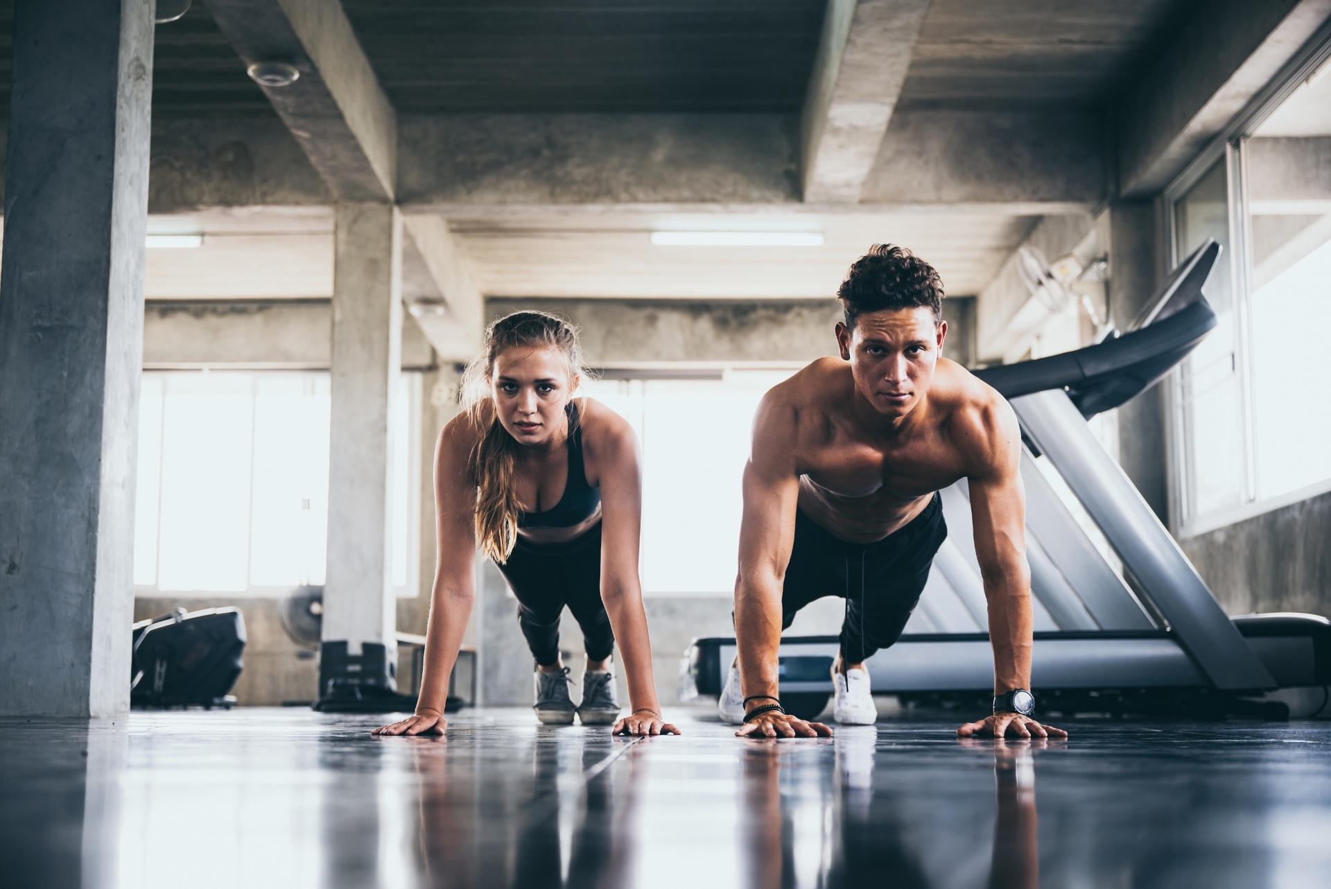 woman and man doing plank