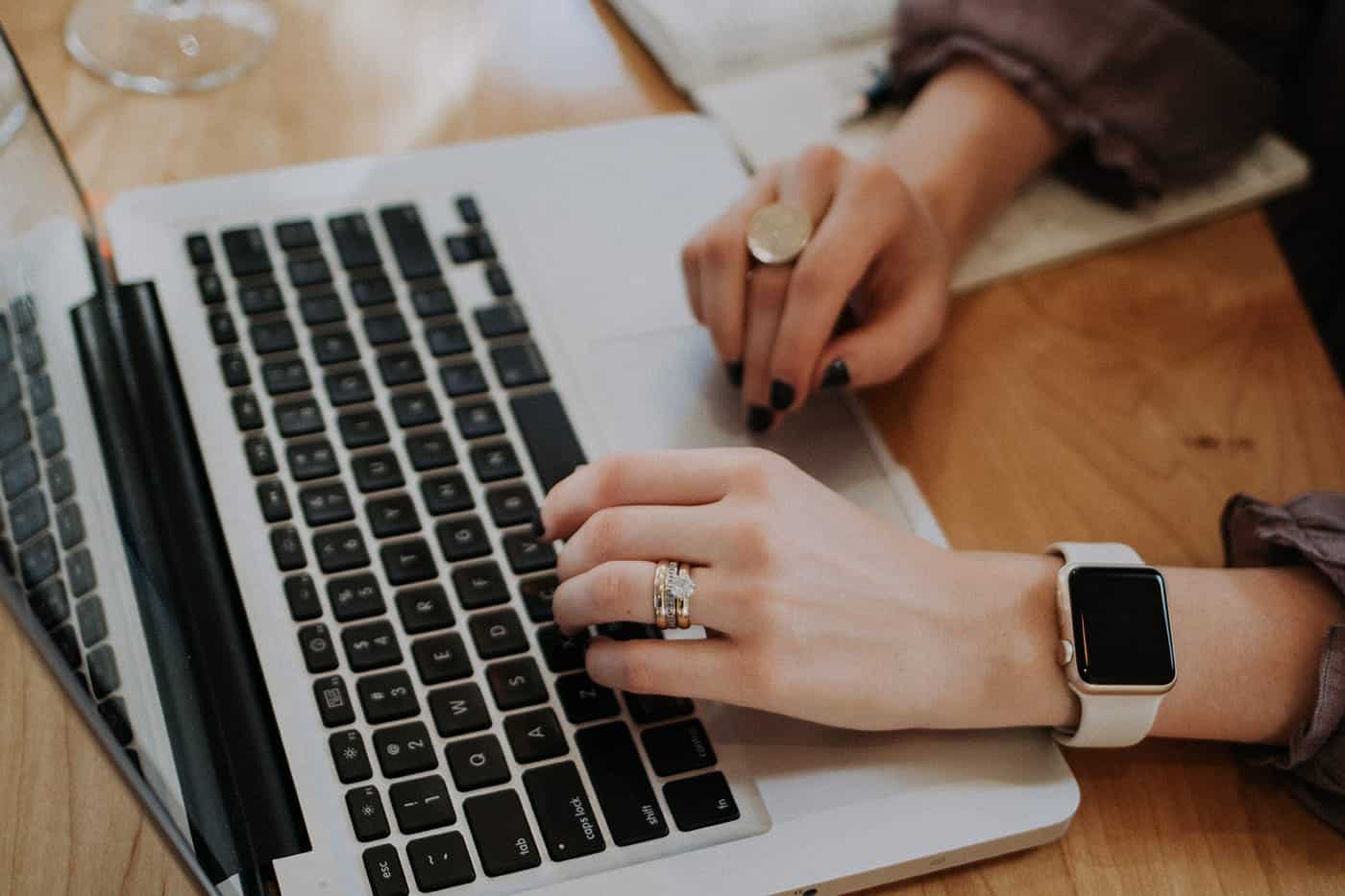 female entrepreneur typing at a computer