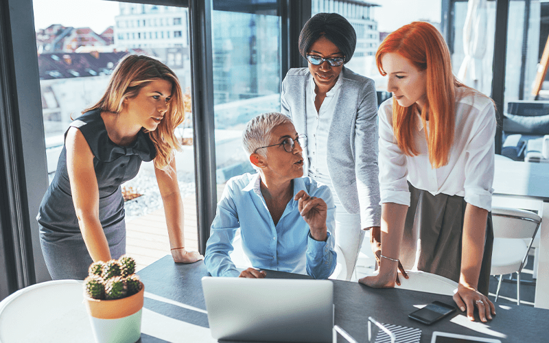 Womeneurs discussing business around a table