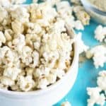 popcorn in white bowl with homemade popcorn seasoning