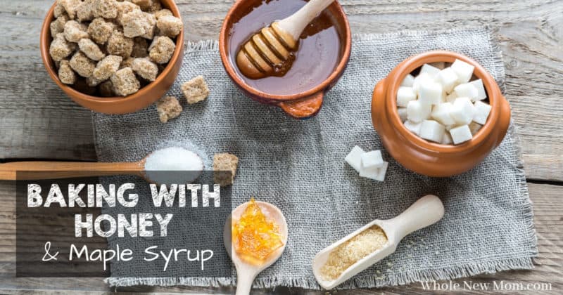 honey and different types of sugar in bowls, scoops, and wooden spoons for post about baking with honey and baking with maple syrup