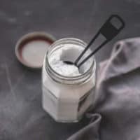 powdered egg replacer in glass jar with spoon