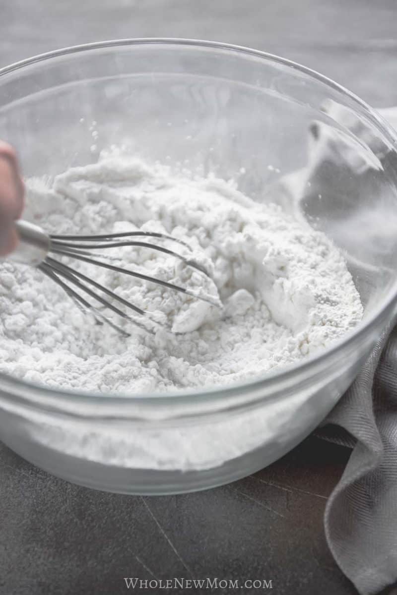 whisk mixing powdered egg substitute in glass bowl