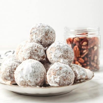 pile of snowball cookies on a plate