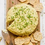 sunflower seed cheese with some crackers and a knife