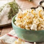 herb popcorn in a green bowl.