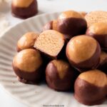 healthy peanut butter buckeyes on a plate.