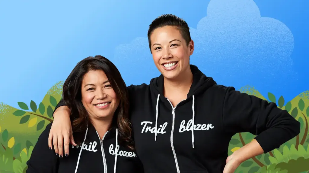 Two community members wearing Trailblazer hoodies.