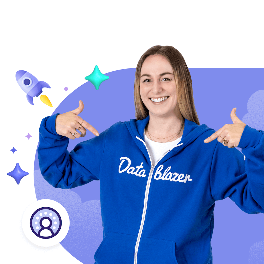 A person smiling wearing a hoody and pointing to a logo on the clothing that says Datablazer on it