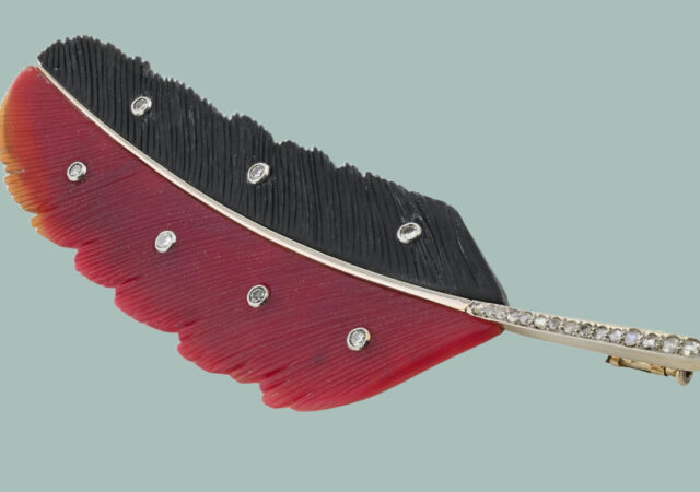 featured image for post: This Intricately Carved Feather Brooch Is a Work of Art