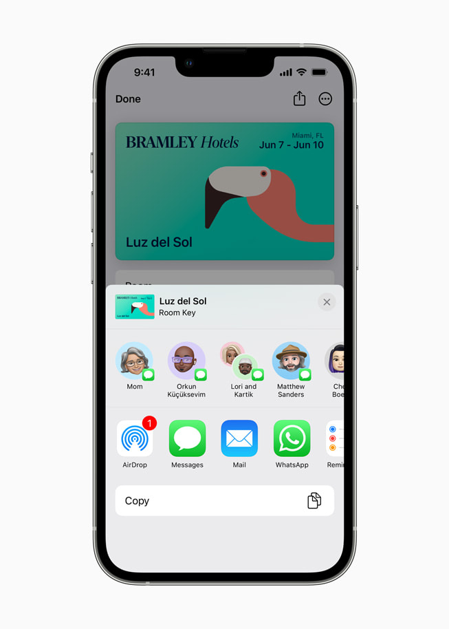 An iPhone screen shows a user’s options for digitally sharing a hotel room key.