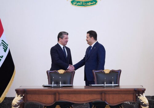 Iraqi Prime Minister Mohammed Shia al-Sudani and his Kurdish counterpart Masrour Barzani sign deal to restart northern oil exports in Baghdad, April 4, 2023.