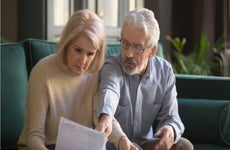 Husband and wife look over financial documents