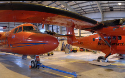 Orange aircraft in a hanger